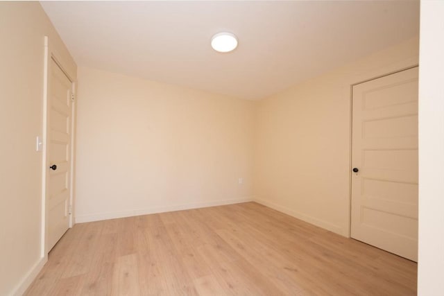 spare room with light wood-type flooring