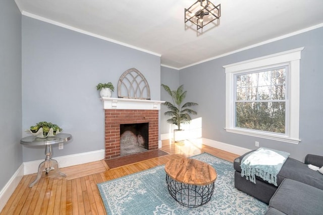 living room with a fireplace, hardwood / wood-style floors, and ornamental molding