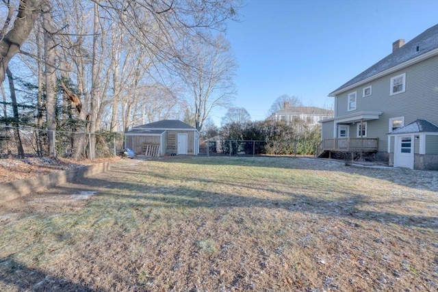 view of yard with an outbuilding and a deck