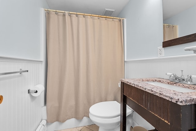 full bathroom with toilet, vanity, shower / bath combination with curtain, and tile patterned floors