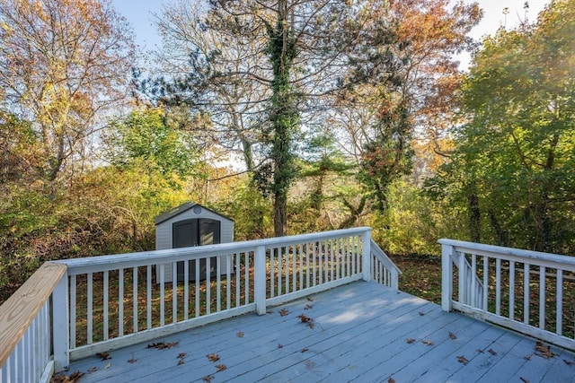 wooden terrace featuring a shed