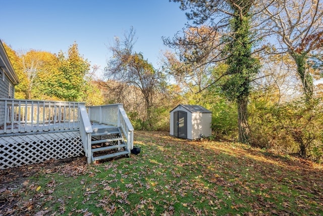 view of yard with a shed and a deck