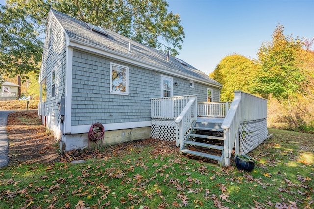 back of house featuring a deck