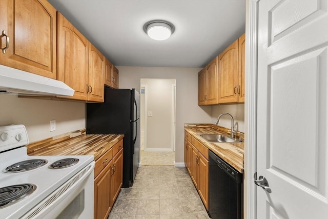 127 King St Unit 104, Franklin, MA 02038 - kitchen featuring black appliances, under cabinet range hood, a sink, baseboards, and butcher block countertops