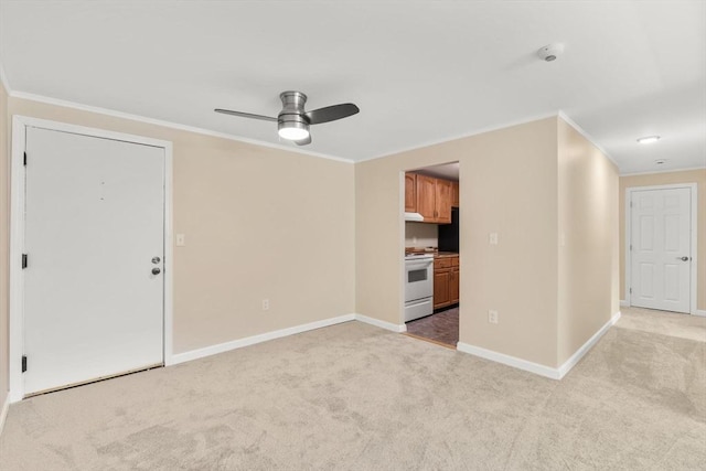 127 King St Unit 104, Franklin, MA 02038 - spare room with ceiling fan, light carpet, ornamental molding, baseboards, and a smoke detector