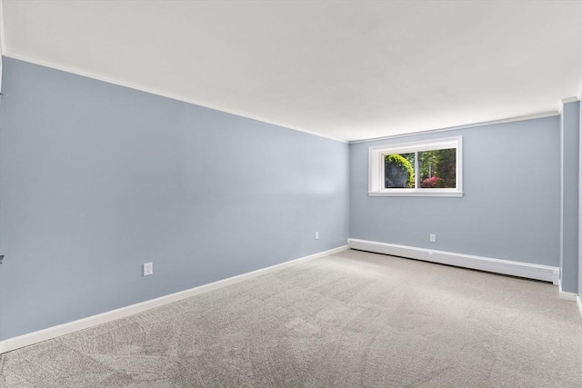 127 King St Unit 104, Franklin, MA 02038 - carpeted spare room with a baseboard radiator, baseboards, and ornamental molding
