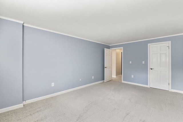 127 King St Unit 104, Franklin, MA 02038 - unfurnished bedroom with crown molding, baseboards, and carpet