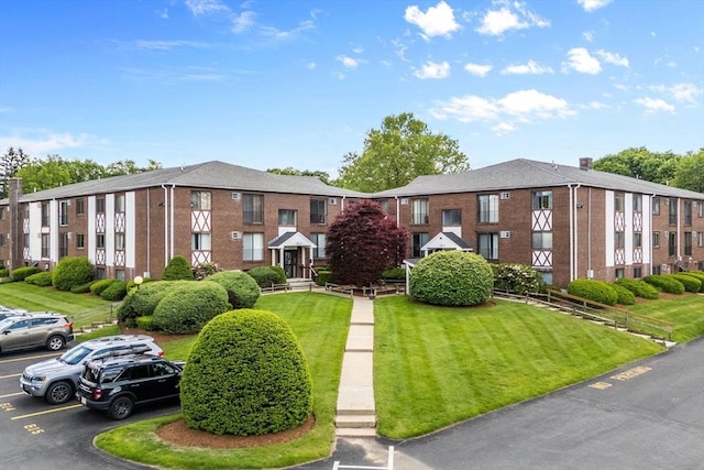 127 King St Unit 104, Franklin, MA 02038 - view of building exterior with uncovered parking