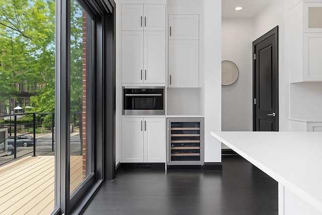 8 Rutland Sq Unit 2, Boston, MA 02118 - bar featuring beverage cooler, dark wood-style flooring, recessed lighting, and oven