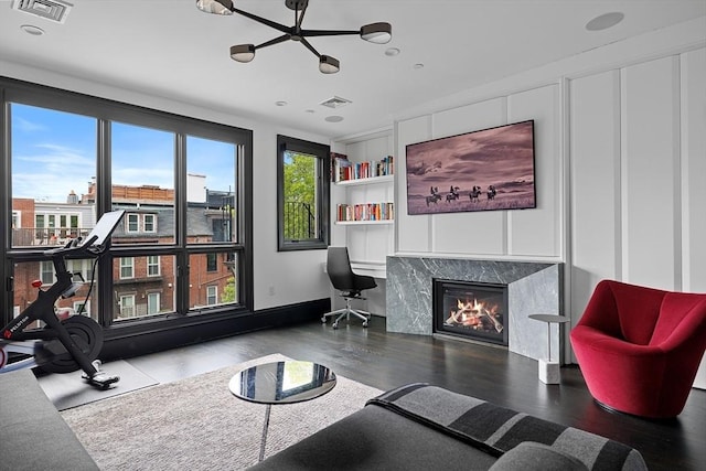 8 Rutland Sq Unit 2, Boston, MA 02118 - living area featuring wood finished floors, a premium fireplace, and built in features