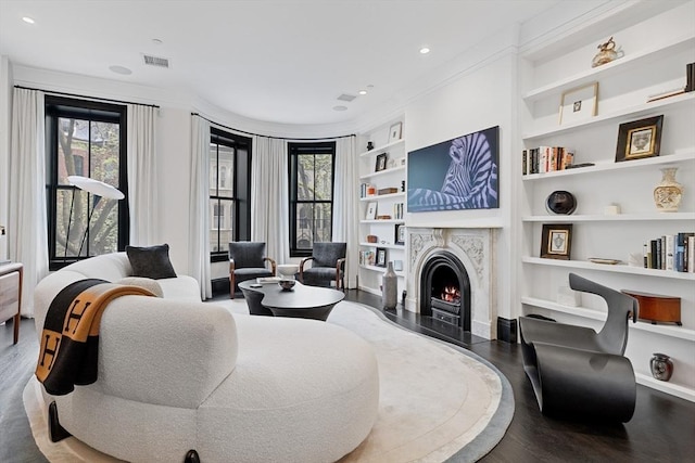 8 Rutland Sq Unit 2, Boston, MA 02118 - living room featuring built in features, wood finished floors, a fireplace, recessed lighting, and crown molding