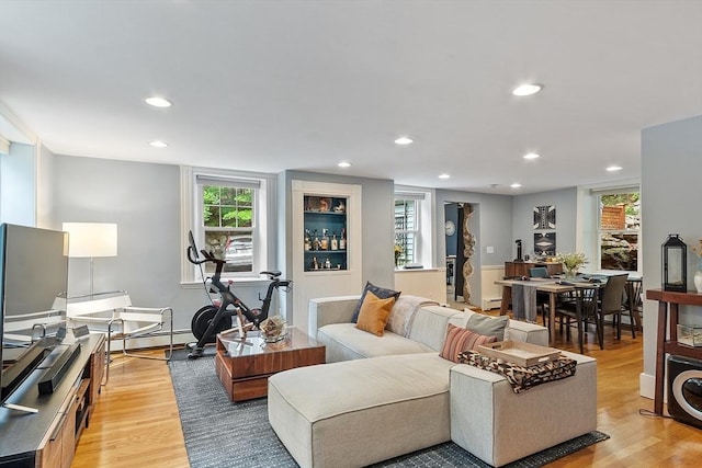 18 River St Unit 18, Andover, MA 01810 - living area with light wood-style flooring, recessed lighting, plenty of natural light, and a baseboard radiator
