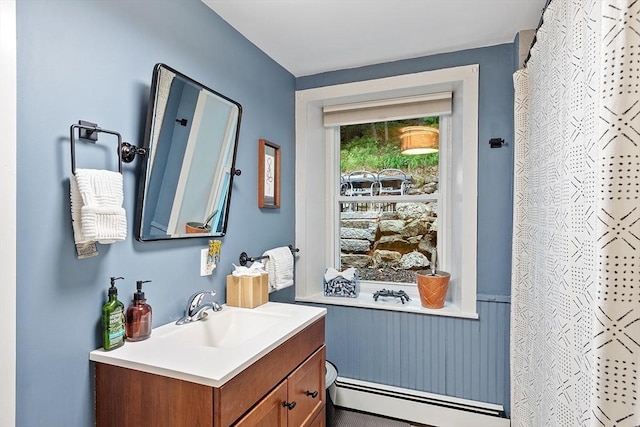 18 River St Unit 18, Andover, MA 01810 - full bath with baseboard heating, vanity, a shower with shower curtain, and a wainscoted wall