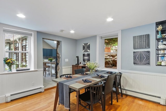 18 River St Unit 18, Andover, MA 01810 - dining space featuring baseboard heating, wainscoting, wood finished floors, plenty of natural light, and recessed lighting