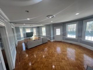 unfurnished living room with plenty of natural light