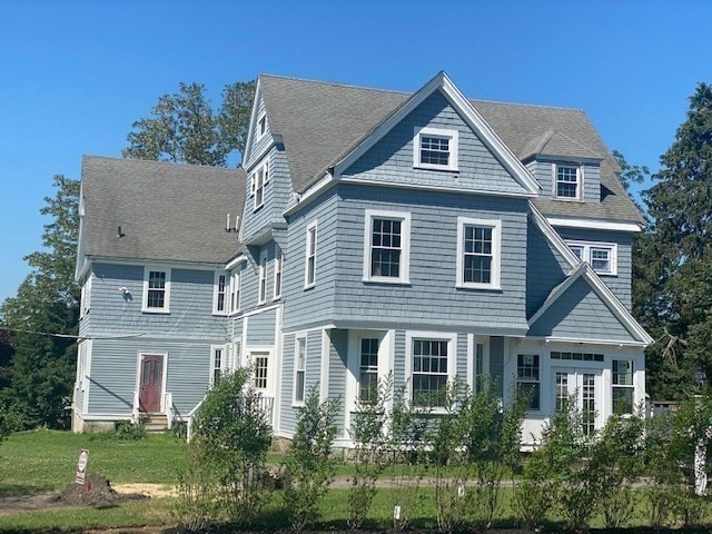 view of front of house with french doors and a front yard