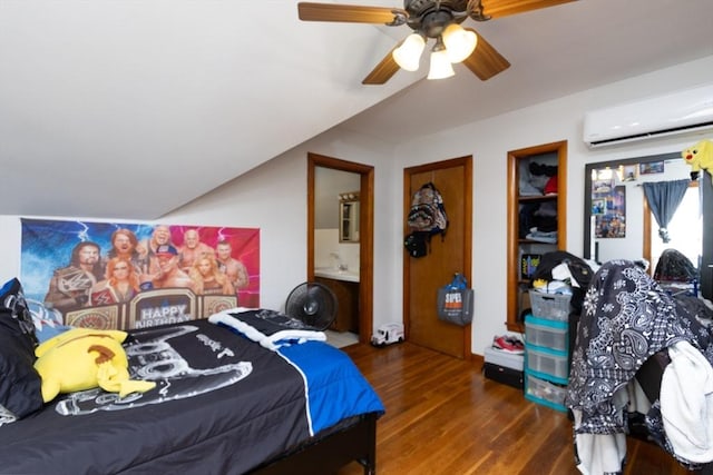 76 Blackstone River Rd, Worcester, MA 01607 - bedroom with a wall mounted air conditioner, wood finished floors, lofted ceiling, ceiling fan, and ensuite bath