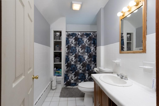 76 Blackstone River Rd, Worcester, MA 01607 - bathroom featuring a baseboard radiator, vaulted ceiling, tile patterned flooring, vanity, and toilet