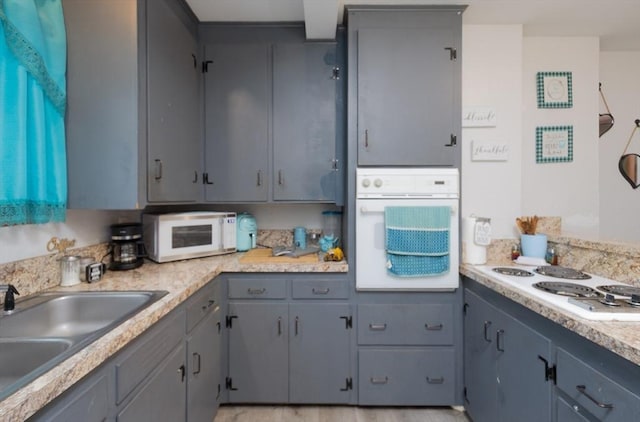76 Blackstone River Rd, Worcester, MA 01607 - kitchen with white appliances, a sink, gray cabinets, and light countertops