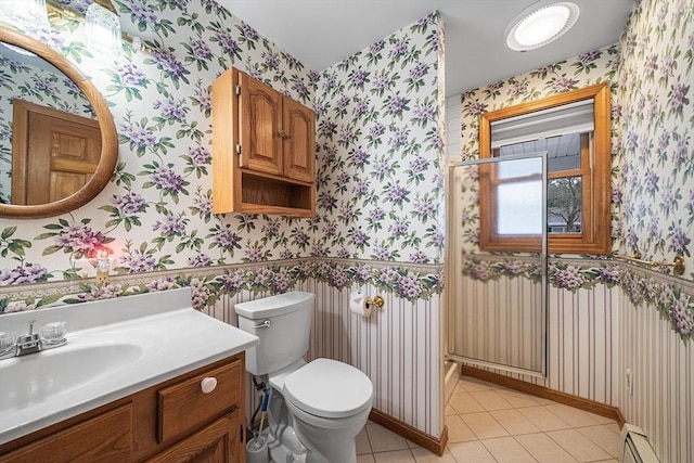 bathroom featuring vanity, a baseboard radiator, tile patterned floors, and toilet