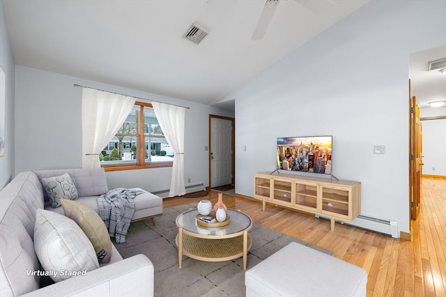 living room featuring vaulted ceiling, hardwood / wood-style floors, ceiling fan, and baseboard heating