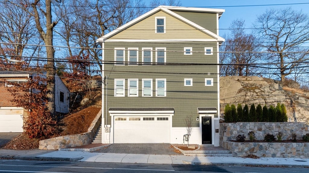 front of property featuring a garage