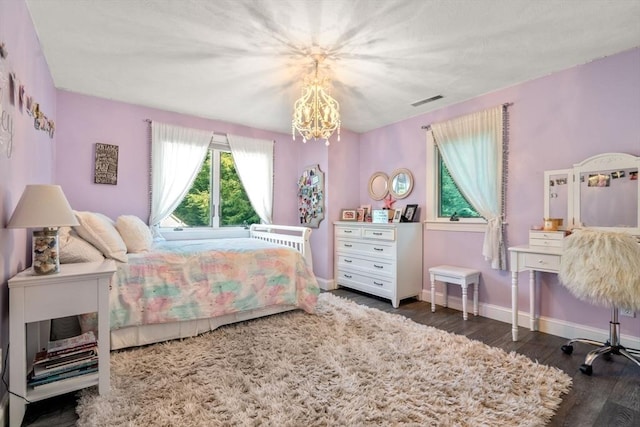 19 Buckmaster Dr, Sudbury, MA 01776 - bedroom featuring baseboards, a notable chandelier, wood finished floors, and visible vents