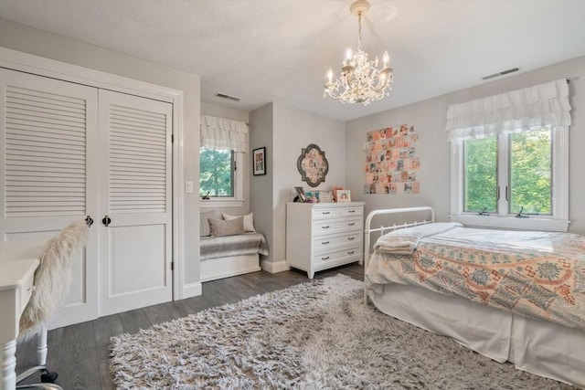 19 Buckmaster Dr, Sudbury, MA 01776 - bedroom with an inviting chandelier, a closet, dark wood-style floors, and visible vents