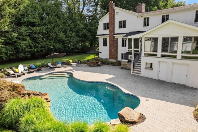 19 Buckmaster Dr, Sudbury, MA 01776 - outdoor pool featuring fence, a patio, and a sunroom