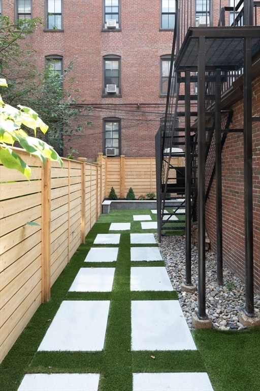 view of yard with a deck and cooling unit