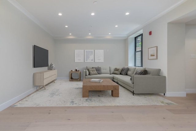 unfurnished living room with crown molding and light wood-type flooring