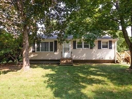 view of front of home with a front yard