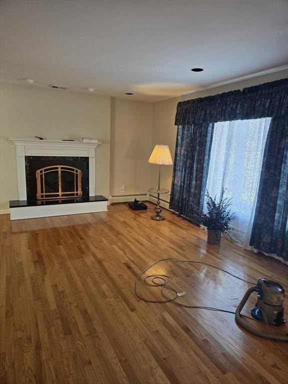 unfurnished living room featuring wood-type flooring