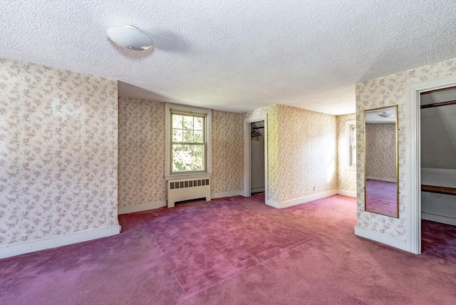 interior space featuring a textured ceiling and radiator