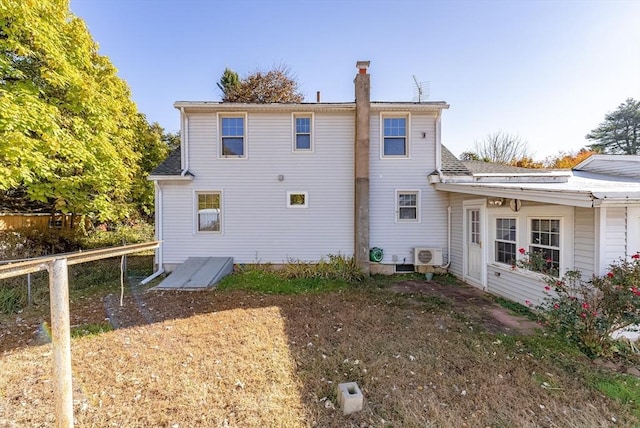 rear view of house featuring ac unit