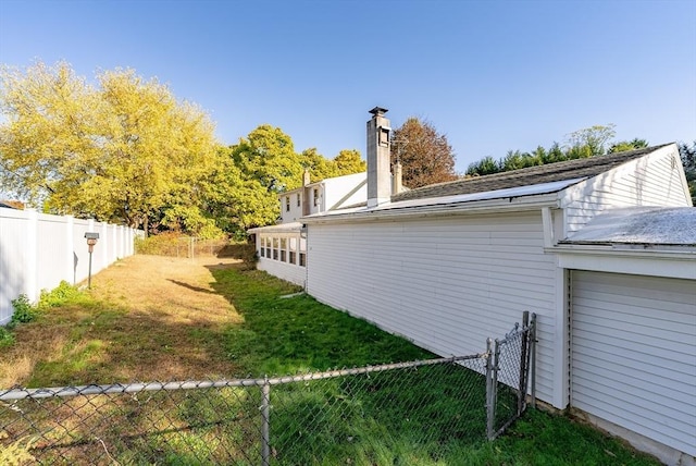 view of home's exterior with a lawn