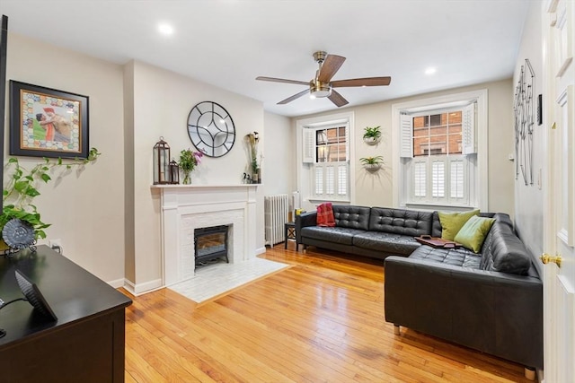 37 Grove St Unit 2, Boston, MA 02114 - living room featuring radiator heating unit, a ceiling fan, light wood-style flooring, baseboards, and recessed lighting