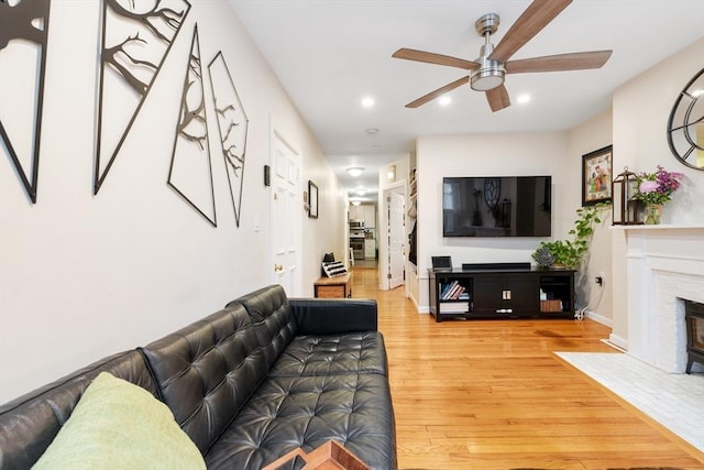 37 Grove St Unit 2, Boston, MA 02114 - living area featuring a ceiling fan, light wood-style floors, a premium fireplace, recessed lighting, and baseboards