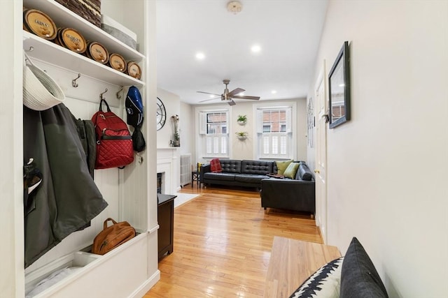 37 Grove St Unit 2, Boston, MA 02114 - mudroom featuring a ceiling fan, light wood-style flooring, a fireplace, and recessed lighting