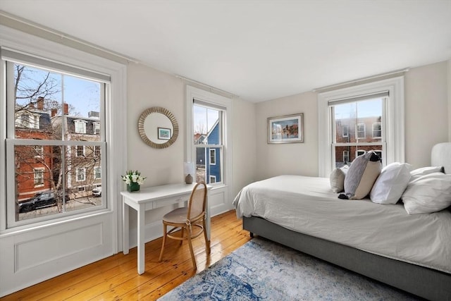 bedroom with light wood finished floors