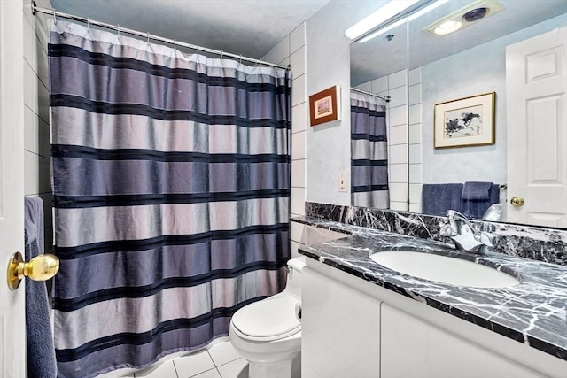 bathroom featuring curtained shower, toilet, vanity, and tile patterned flooring