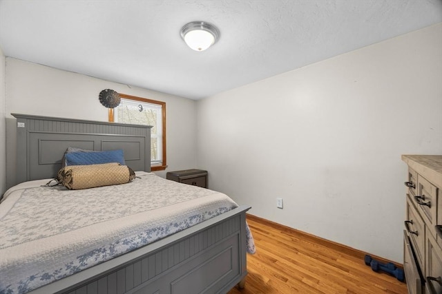 bedroom with light hardwood / wood-style flooring