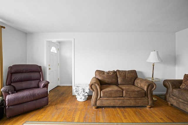 living area featuring wood finished floors and baseboards