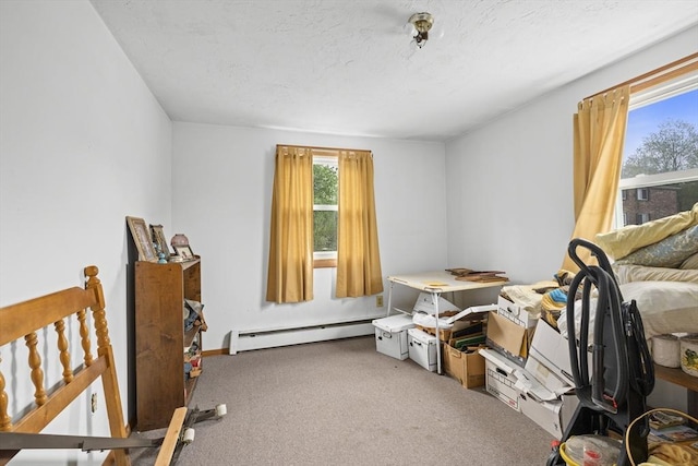 bedroom featuring baseboard heating and carpet