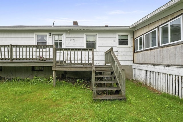 back of property featuring a deck