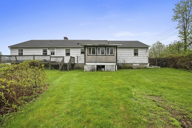 back of property with a wooden deck