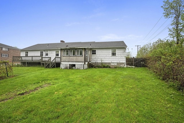 rear view of property with a wooden deck