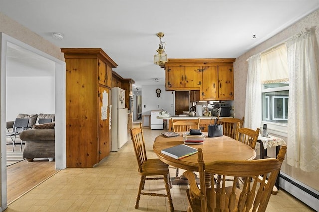 dining area with baseboard heating and washer / clothes dryer