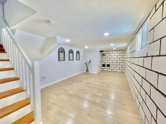 basement featuring light hardwood / wood-style floors