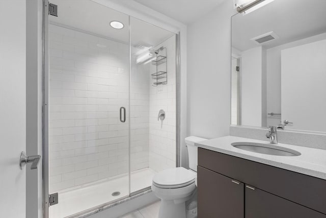 full bath with visible vents, a stall shower, toilet, and vanity